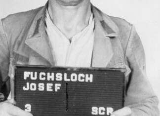 Josef Fuchsloch en kamp Harzungen Haftbogenfoto van Josef Fuchsloch, SS-Oberscharführer en plaatsvervangend Lagerführer van buitenkamp Harzungen.