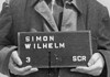 Wilhelm Simon: SS-functionaris in Mittelbau-Dora Haftbogenfoto van Wilhelm Simon, SS-Oberscharführer en Arbeitseinsatzführer in concentratiekamp Mittelbau-Dora.